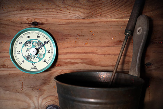 Photo shows the sauna thermometer needle risen to hot 100 degrees centigrade.