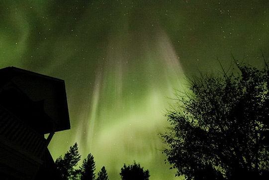 Photo shows Villa Cone Beach under magnificent Northern Lights and stars.