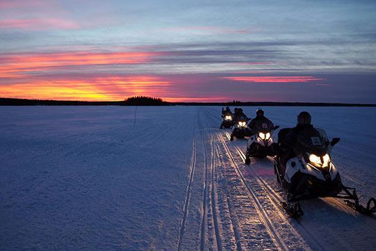 Photo shows Vuokatti Safaris snow mobiles